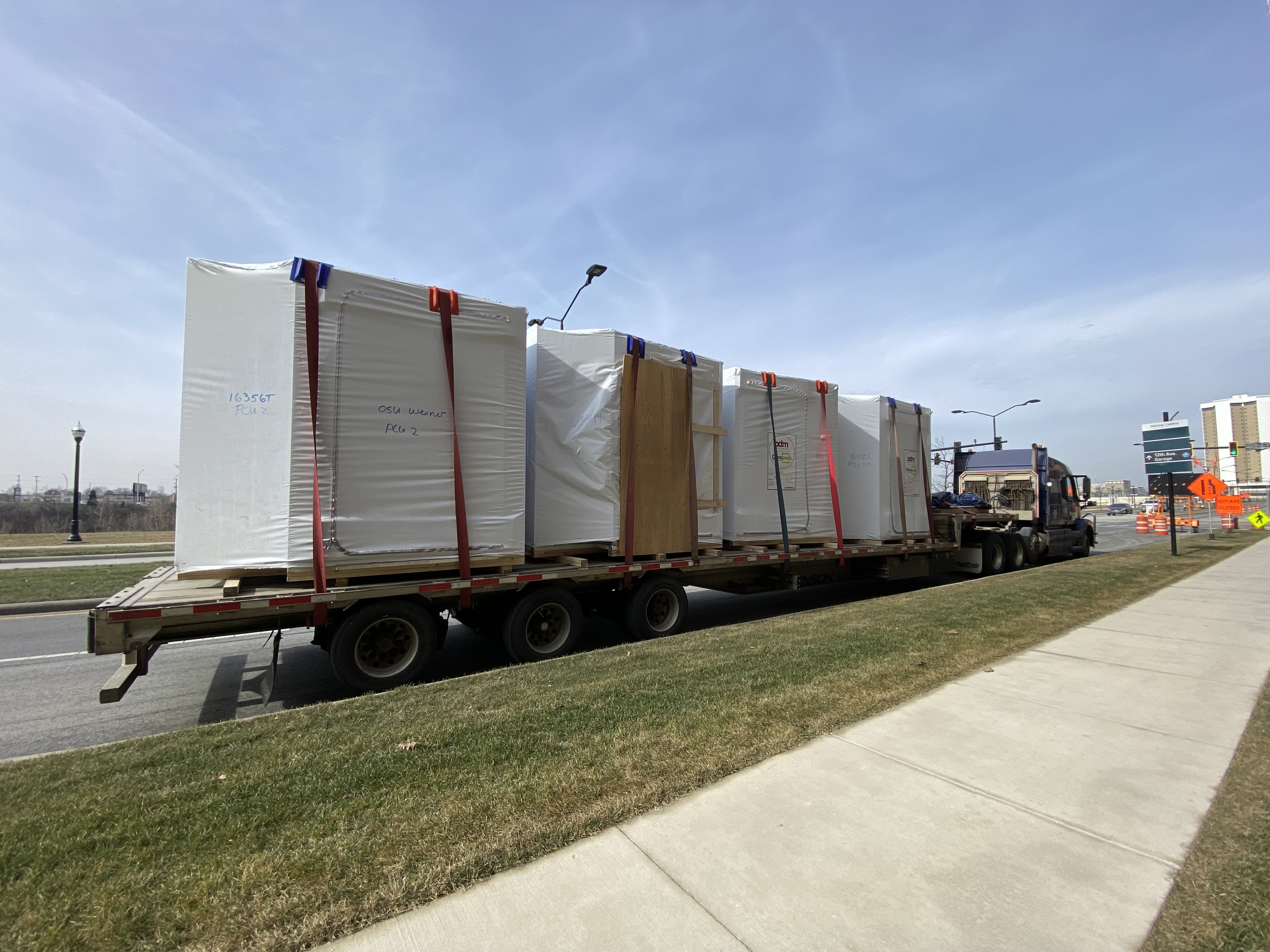 Prefabricated patient toilet rooms arriving at the OSU Tower construction site