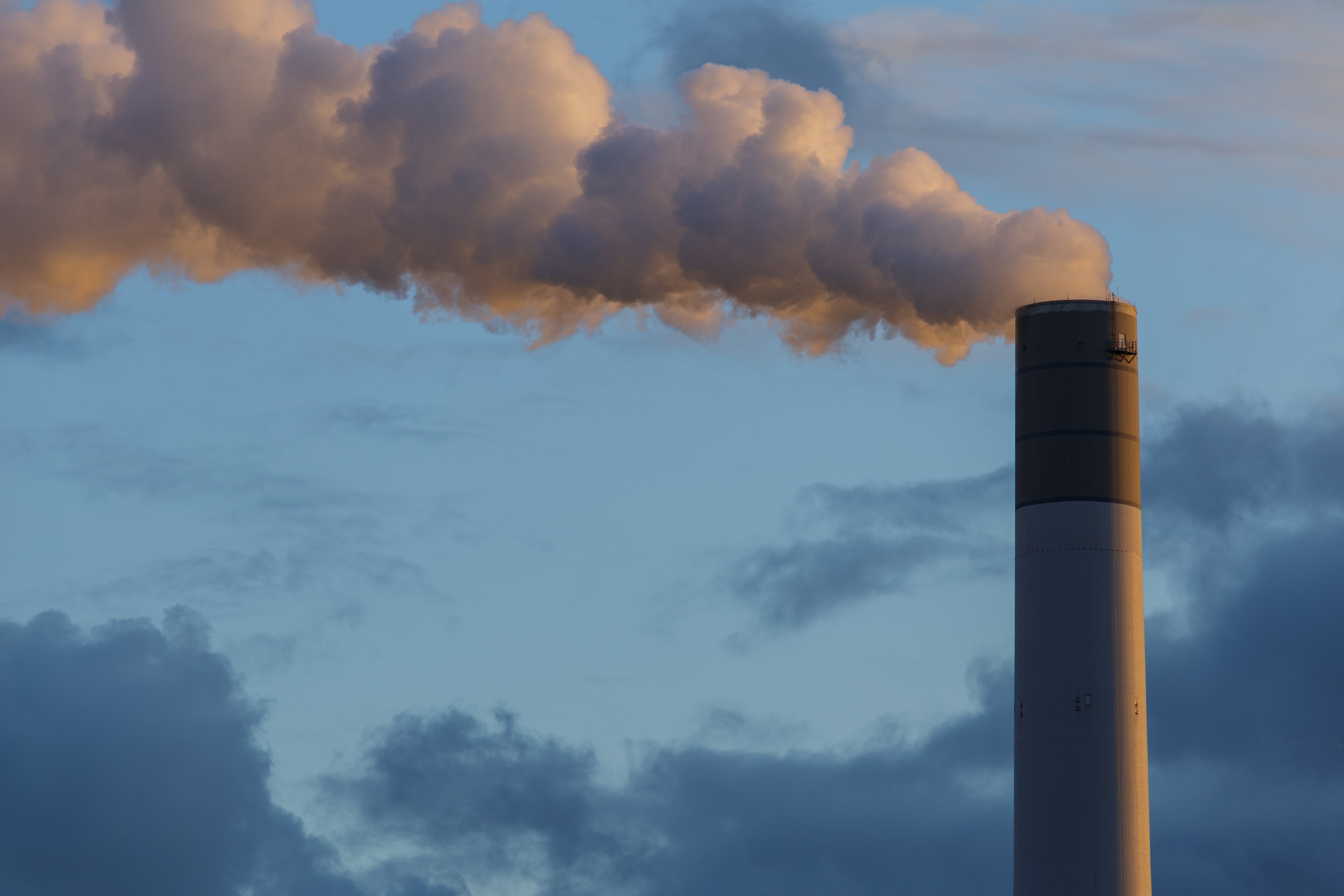 Visible smog radiates from a smoke stack