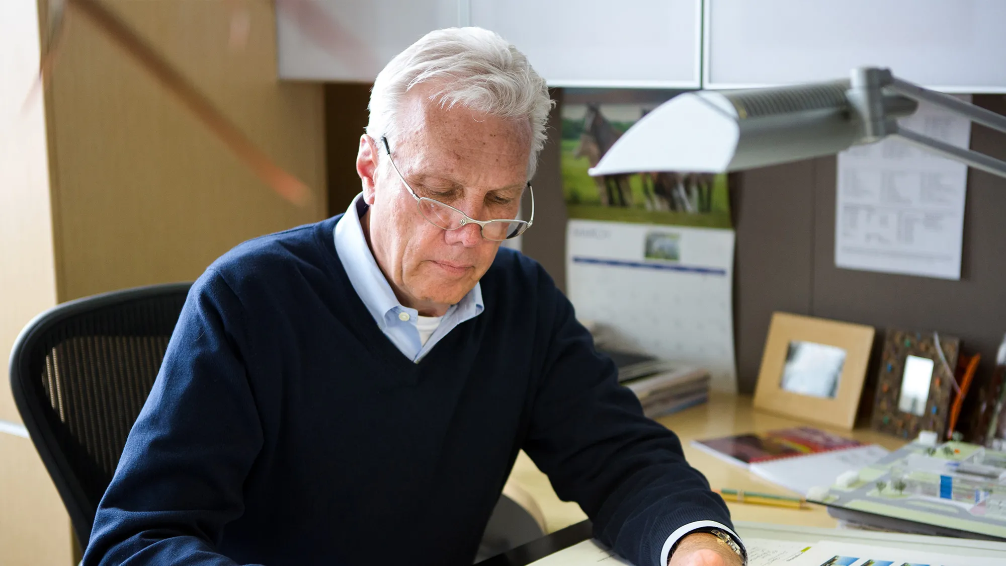 Elliott Bonnie working at his desk.