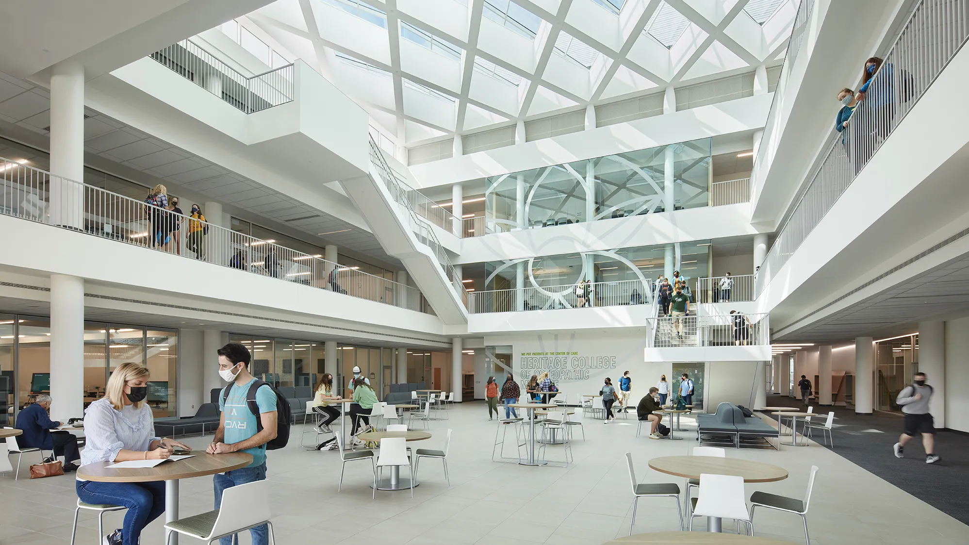 Bright, naturally lit interior view of the Heritage College of Medicine atrium