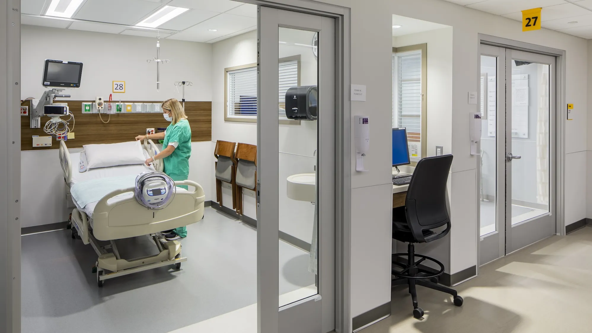 Interior, nurse making a post-operation room bed