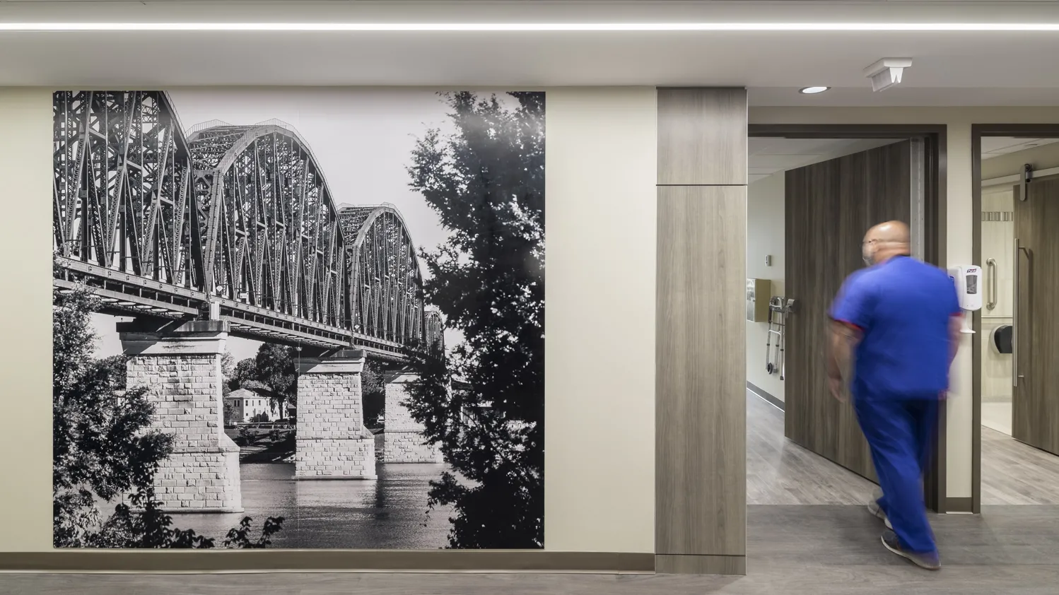 wall with floor-to-ceiling photo of a bridge