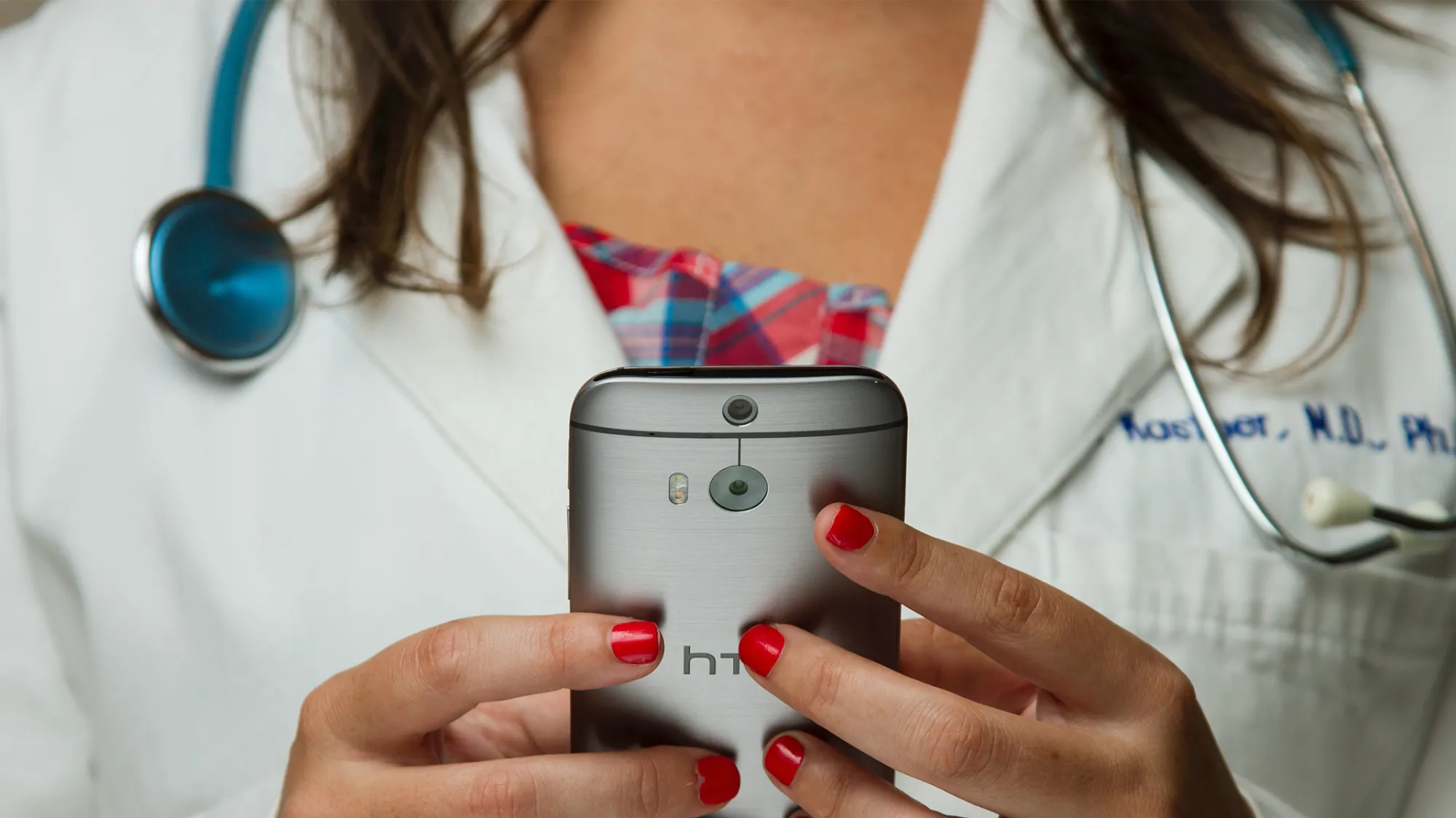 doctor holding cell phone