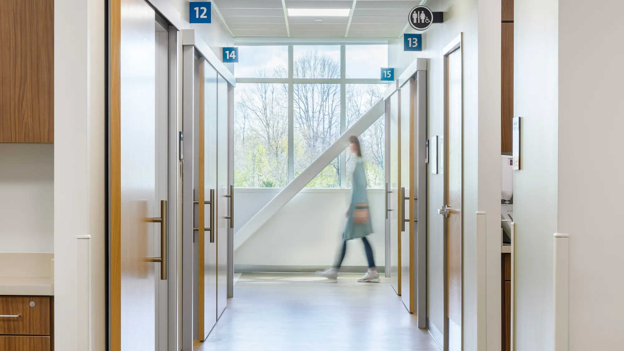 woman walking through corridor