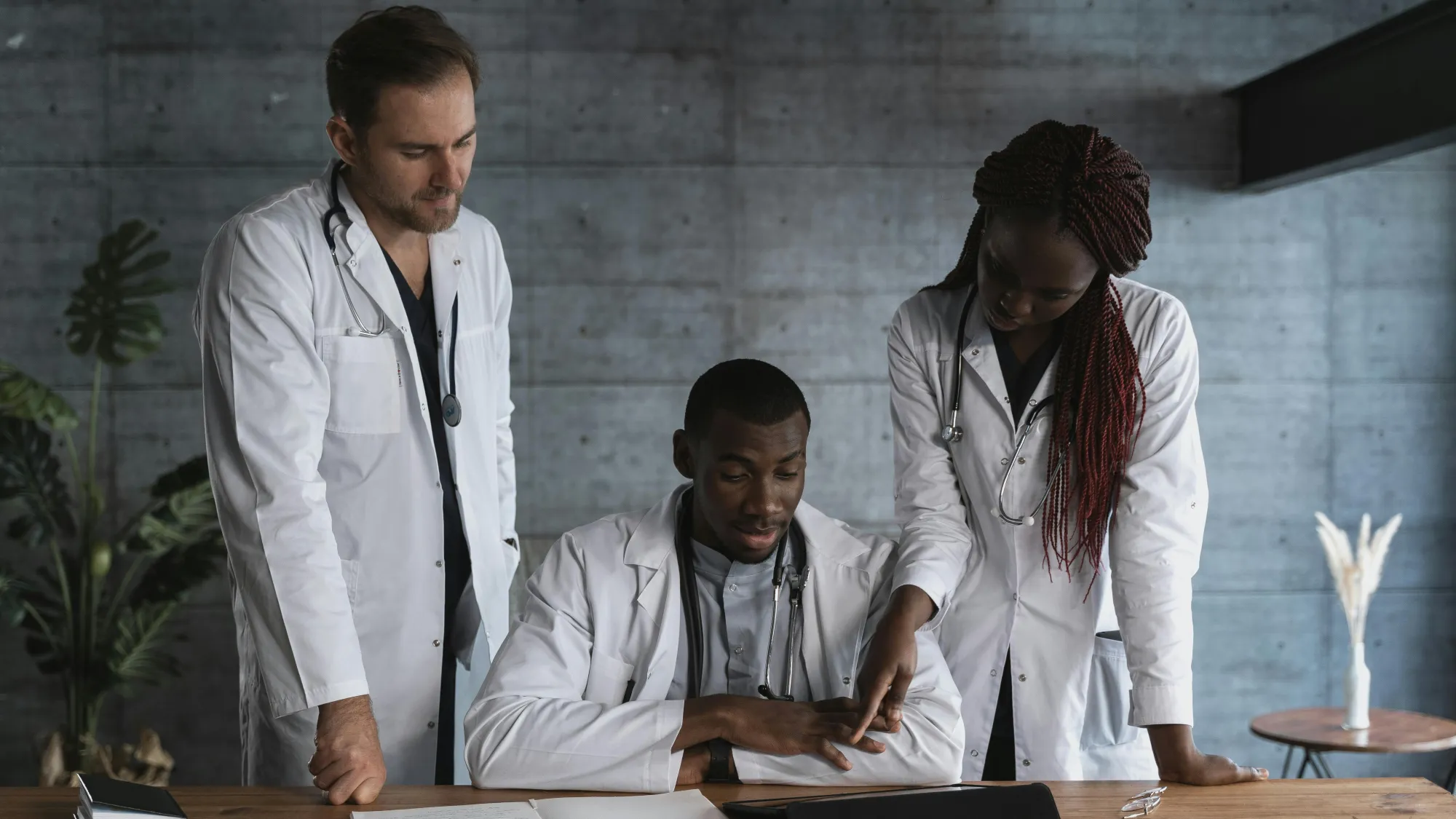 Three doctors collaborating with each other