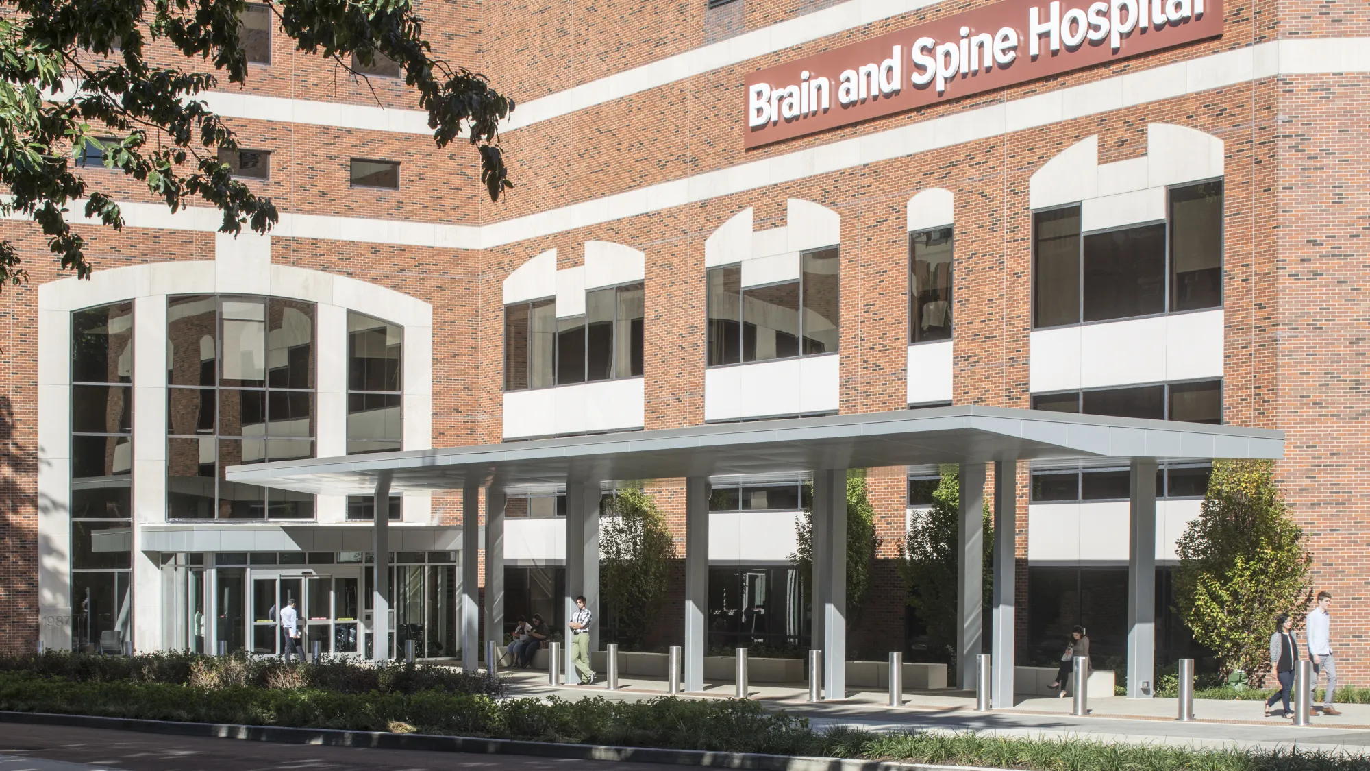 hospital brick facade and metal canopy leading to entrance