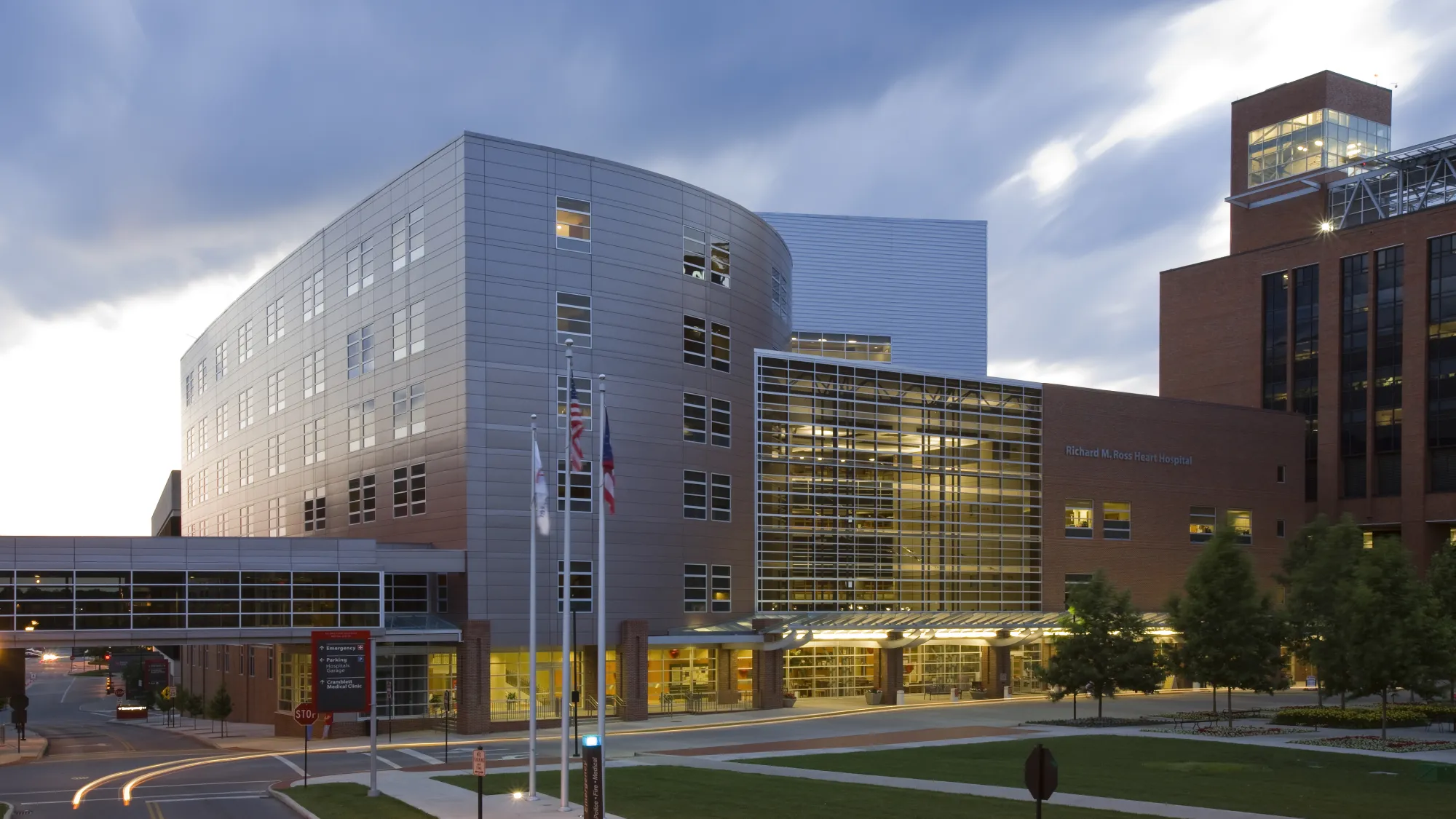 hospital with brick, metal panel, and glass facade