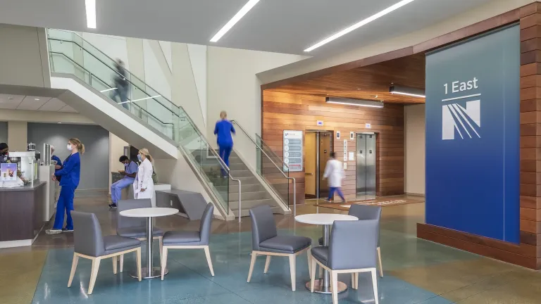 Lobby cafe within the Norton hospital, featuring wood paneling and blue accents