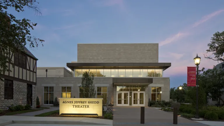 Exterior of the Agnes Jeffrey Shedd Theater in the evening with lights on