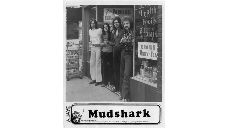 Band poster for Elliott's group, Mudshark. Elliott is on the far left.