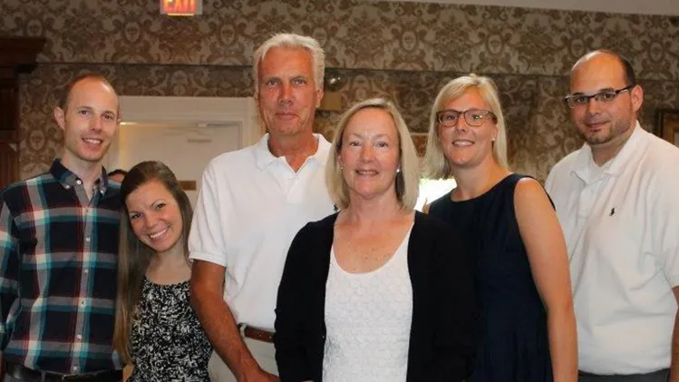 Elliott and his wife Martha, center, with their two children and their spouses.