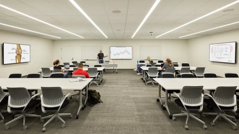 classroom with desks organized in groups