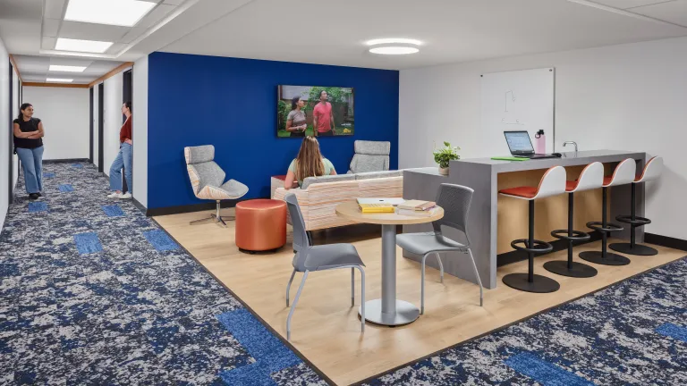 residence hall common space with blue and orange accents
