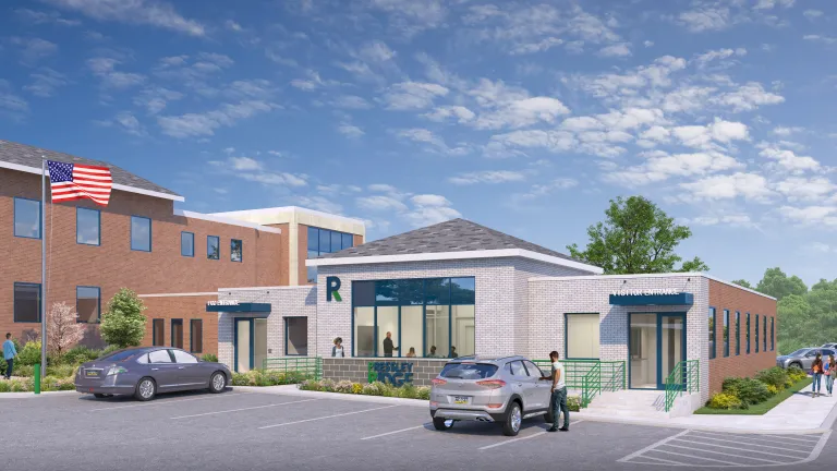 rendering of white stone and red brick building