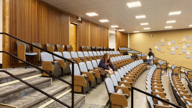 amphitheater-style lecture hall with wood panelling