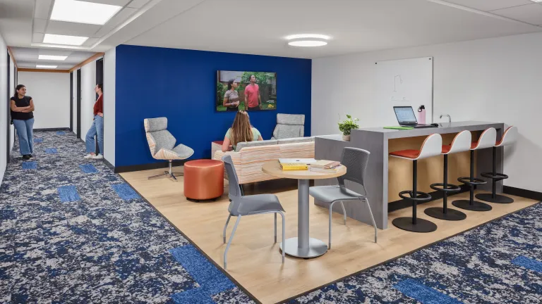 students common area with blue and orange accents