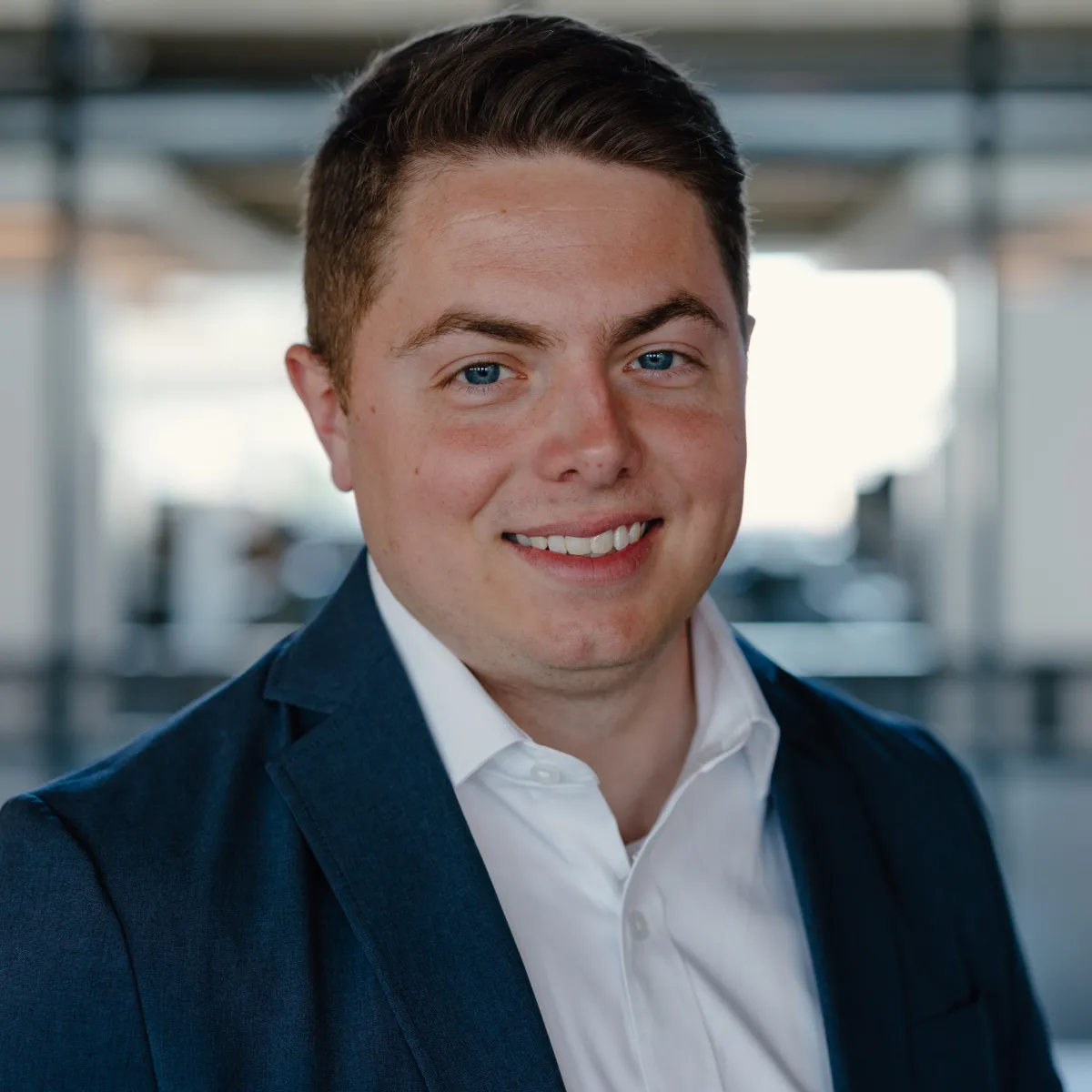 Ben Haywood smiling, wearing blue blazer and white shirt