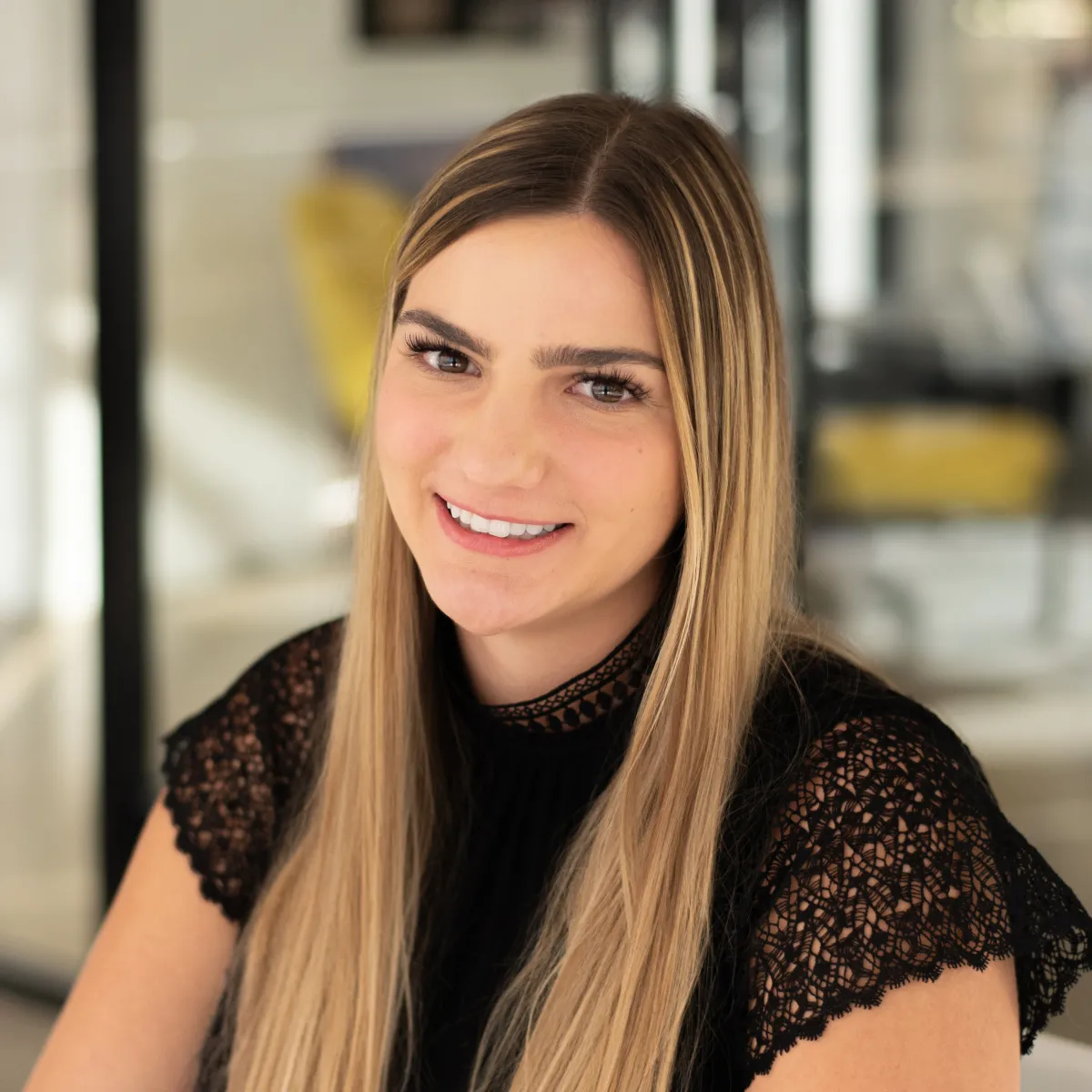 Kristyn Svetlak smiling, wearing a black blouse