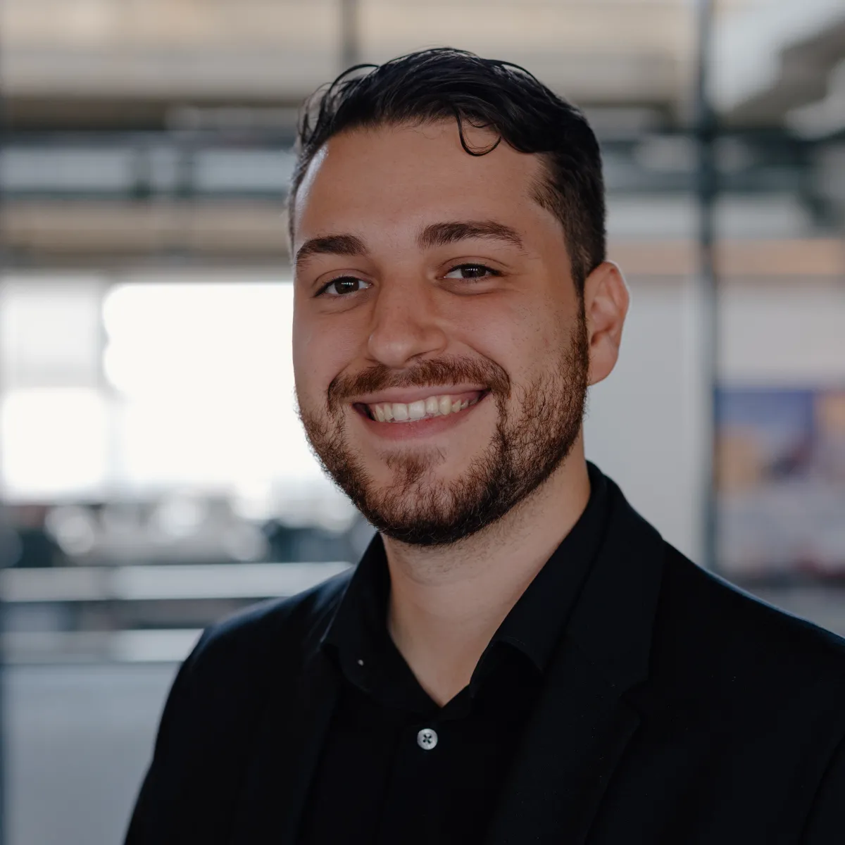 Orlando Echevarria Garcia smiling, wearing a black button down shirt