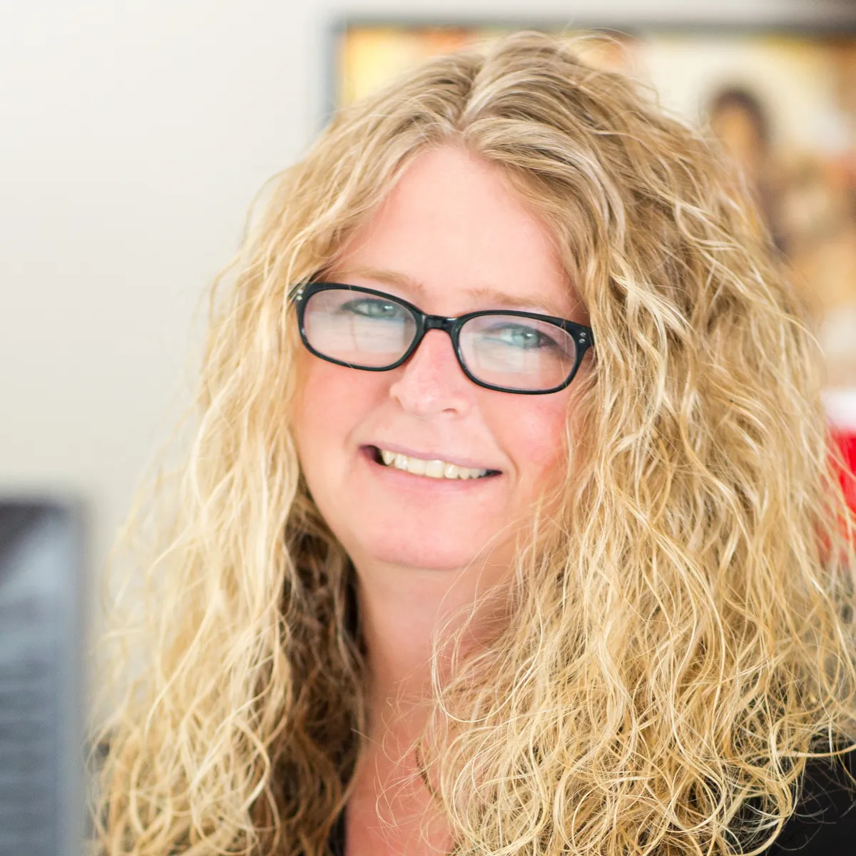 Tammie Wareham smiling, wearing a black blouse
