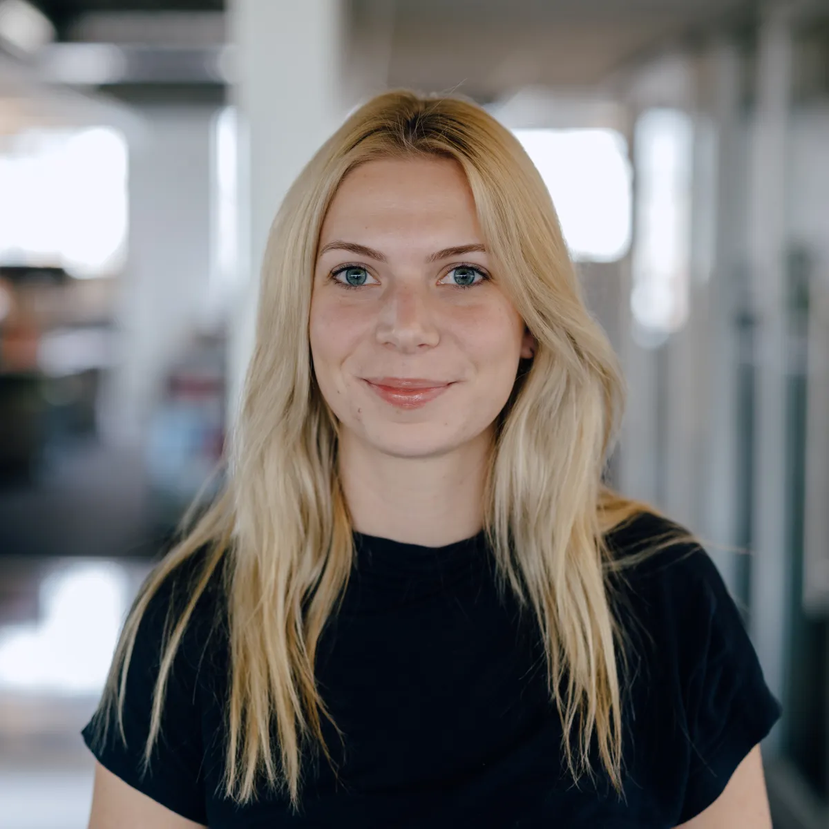 woman with blonde hair and black shirt