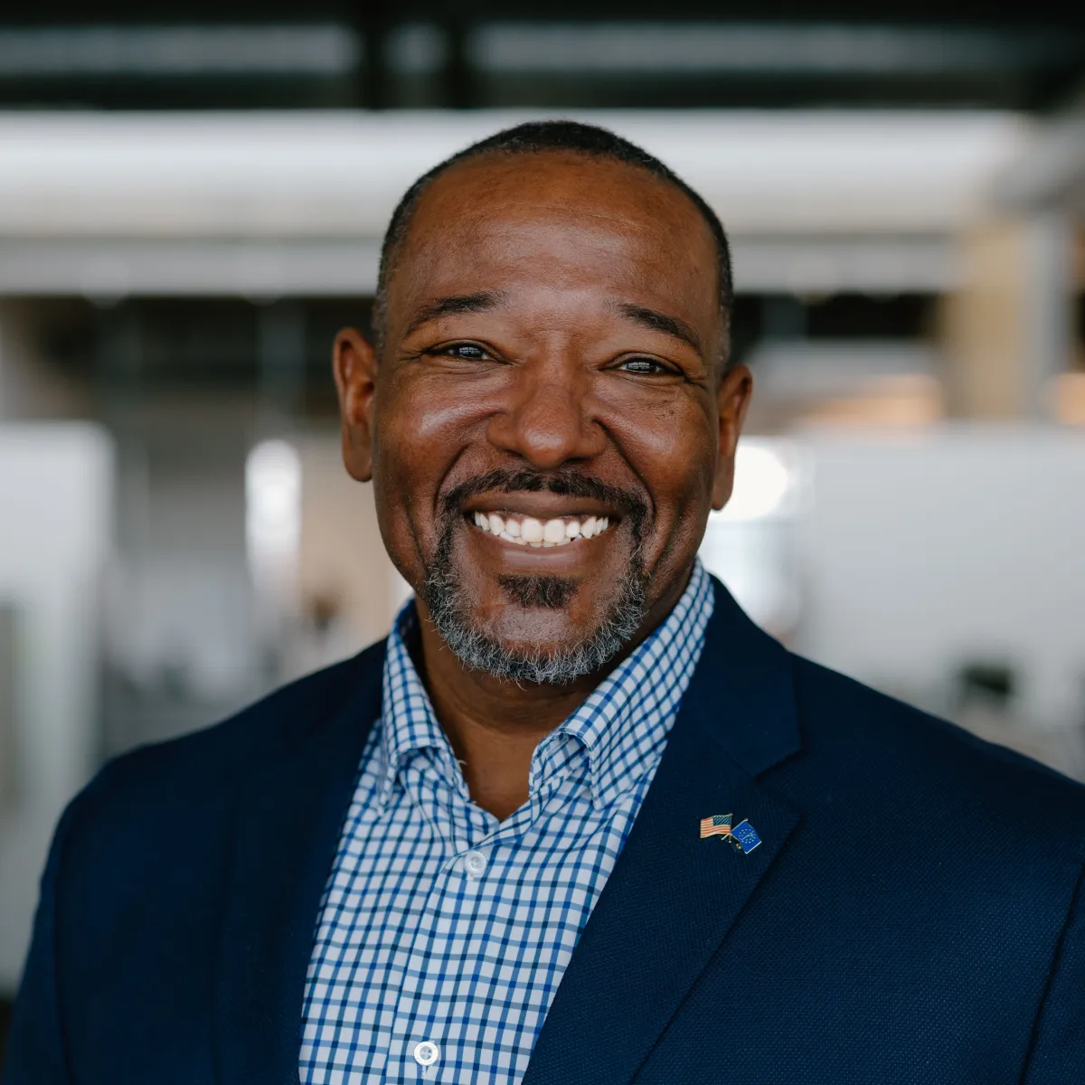 man with blue shirt and jacket