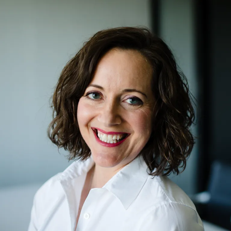 headshot of woman with brown hair