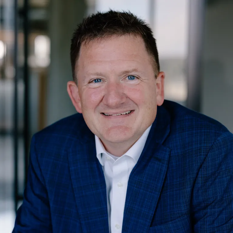 man with plaid navy jacket