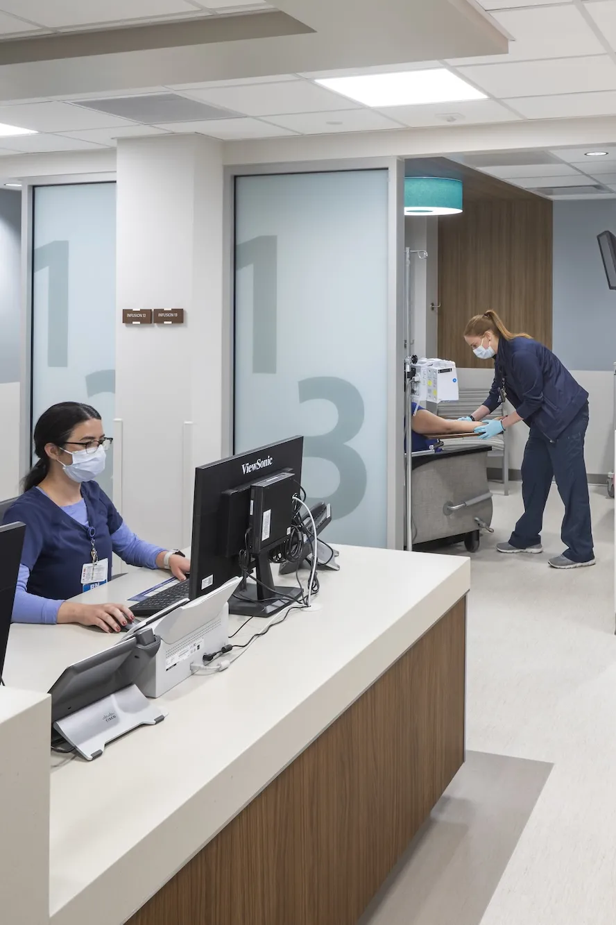 Nurse station with a peek into a couple of blood transfusion patient rooms