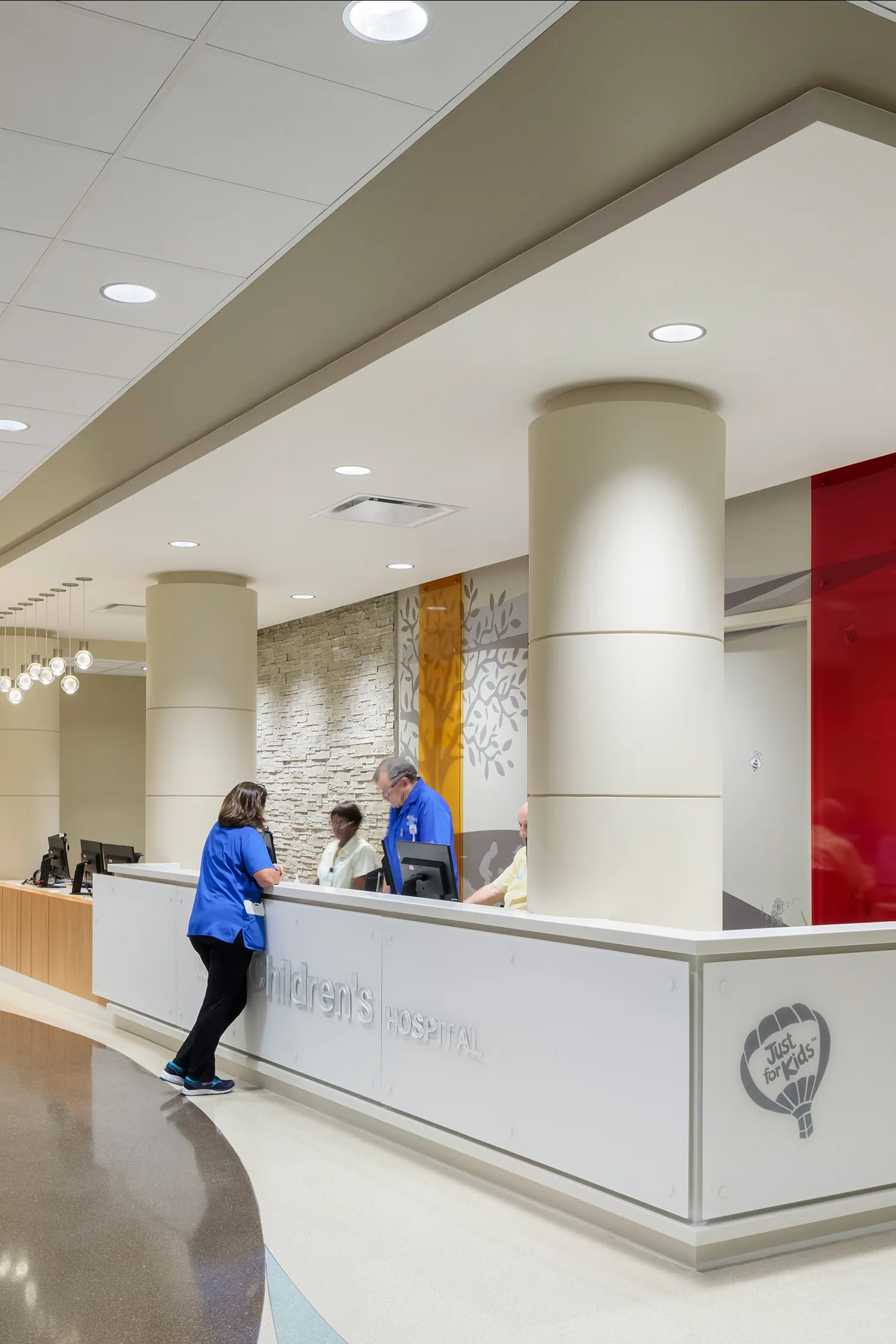 lobby with colorful wall graphic and registration desk