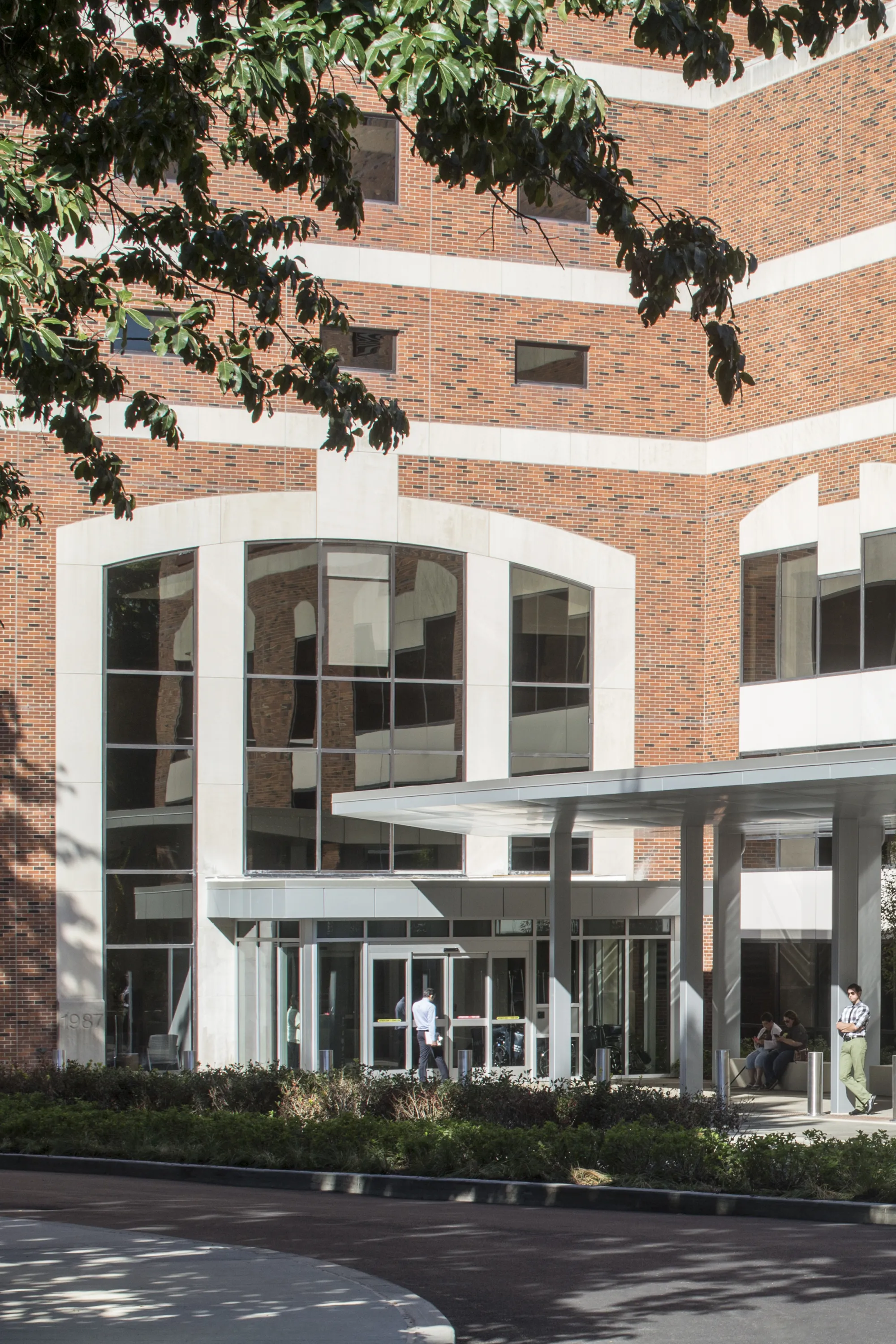 hospital brick facade and metal canopy leading to entrance