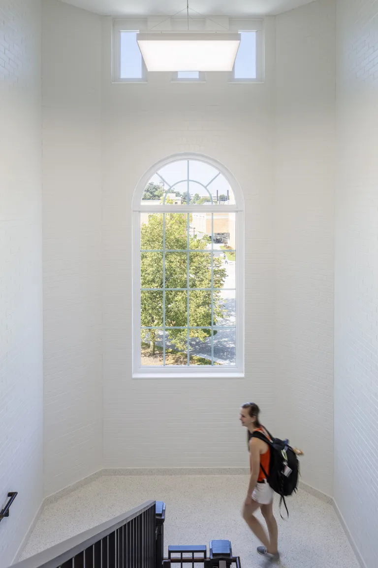 Stairwell with original arched window