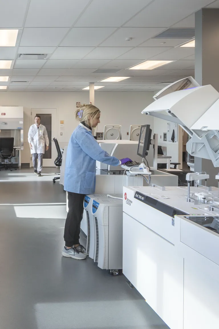 Woman working at laboratory equipment.