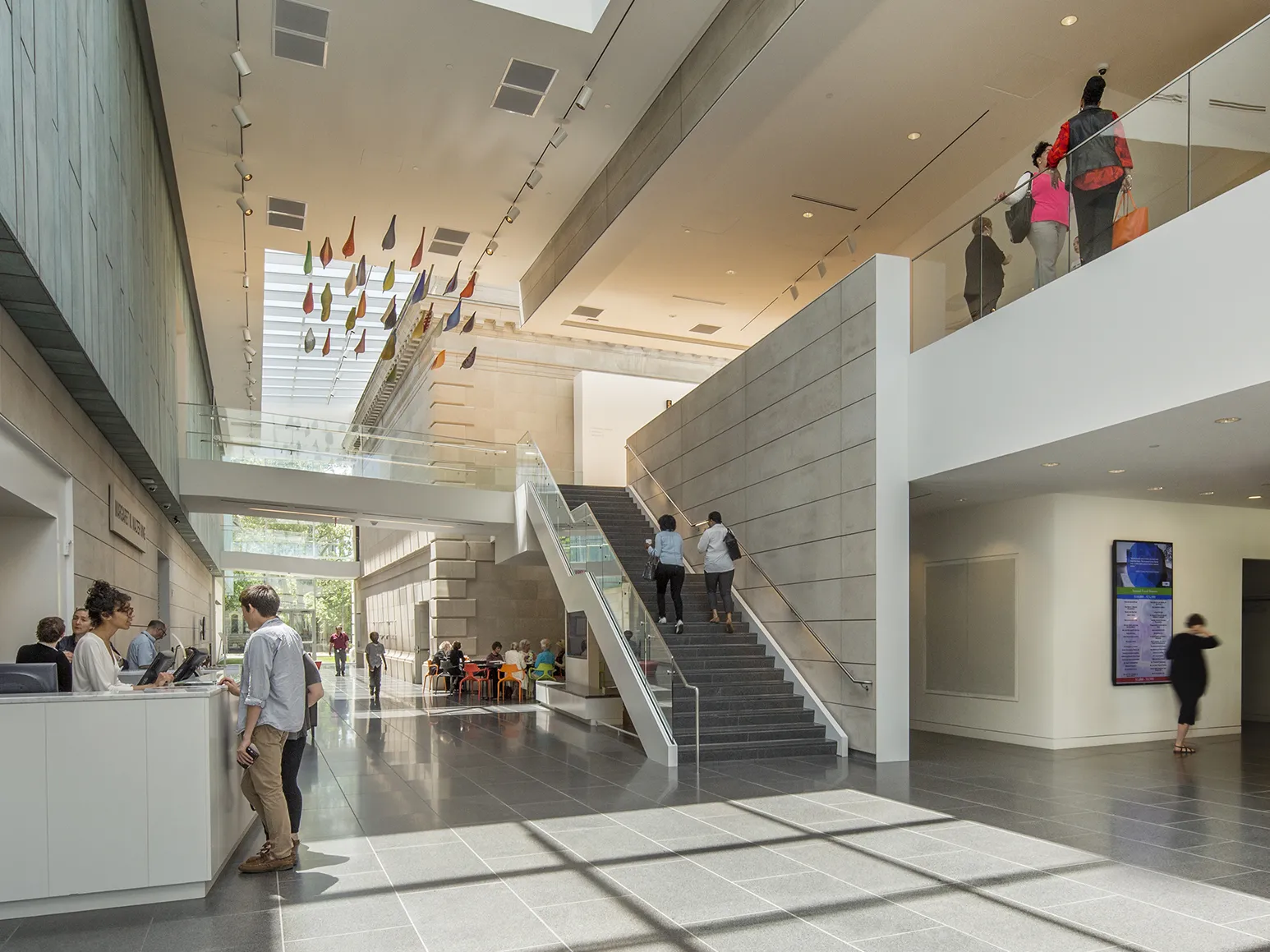 People in the main atrium of the Columbus Museum of Art during the day.