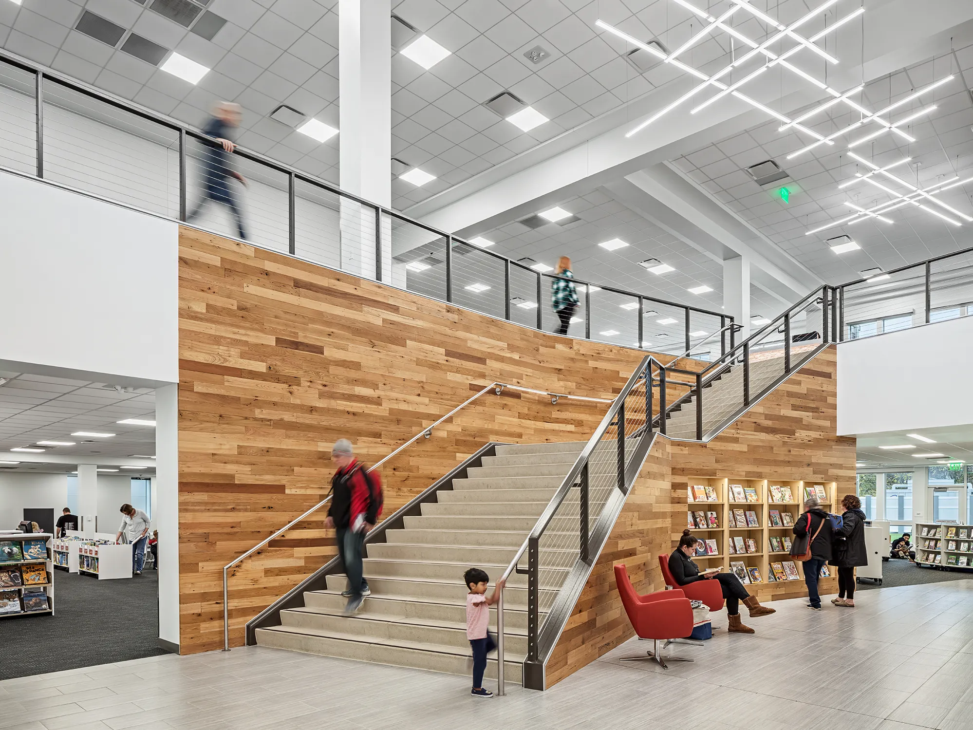 Interior of Hilliard Library featuring stairs with mixed wood paneling