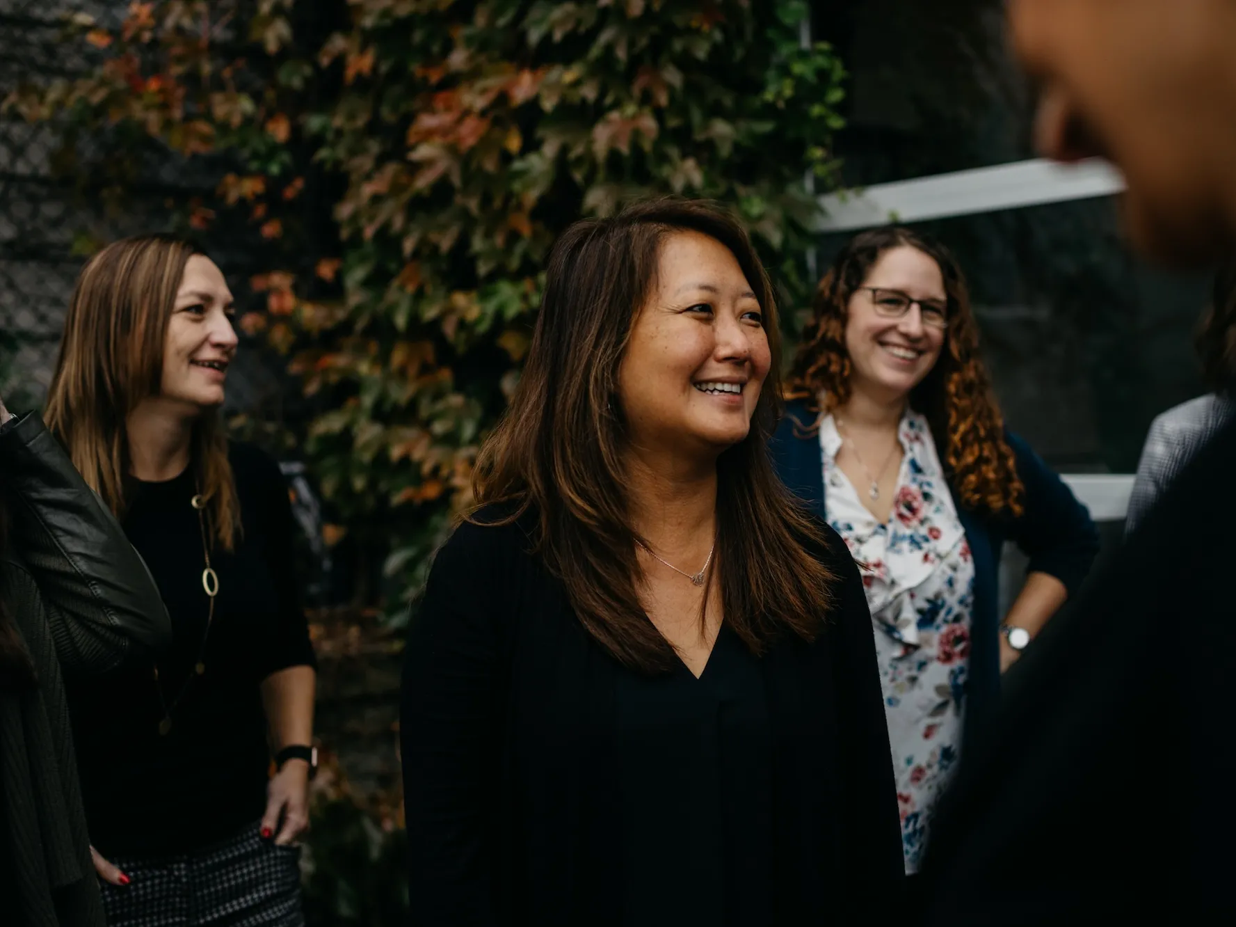 Three smiling Design Group employees