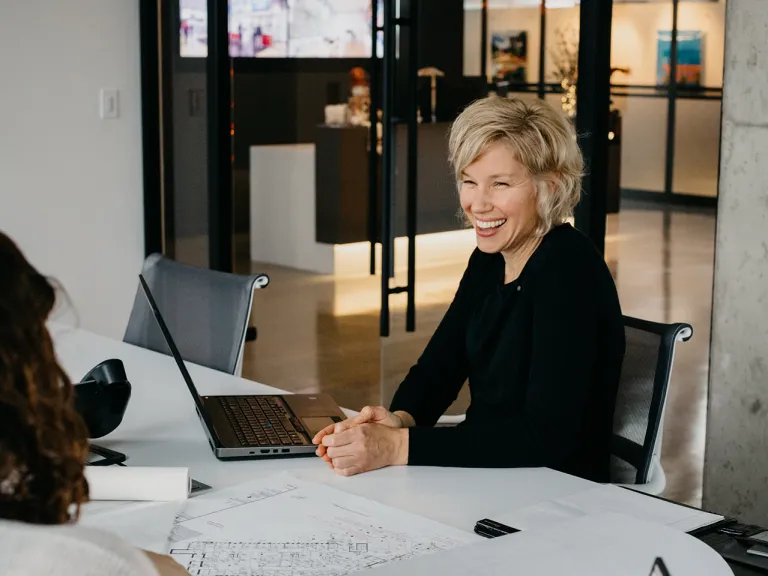 Woman in conference room.