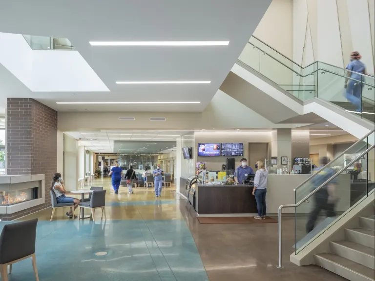 Lobby of the Norton hospital featuring a fireplace and tall staircase