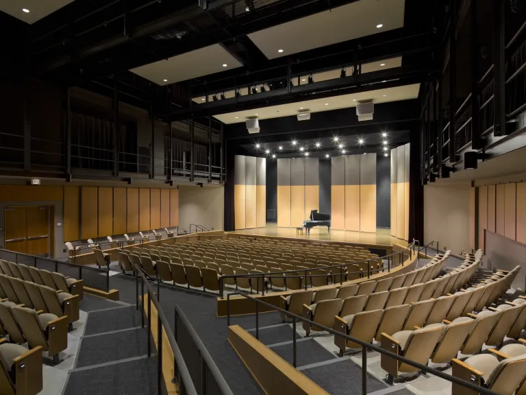 Interior theatre seats, at an angle with all lights on