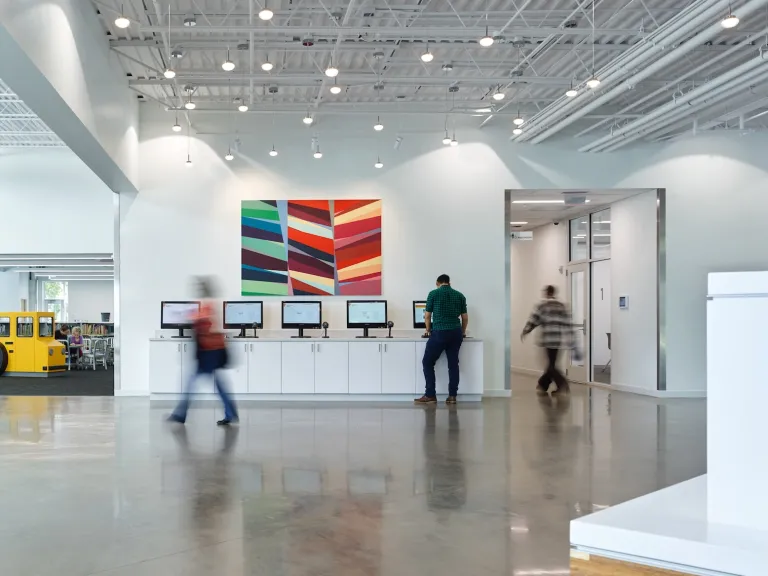 Interior of Northern Lights Columbus Library self check out space with abstract wall art