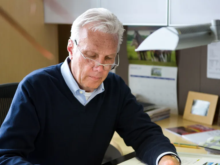 Elliott Bonnie working at his desk.