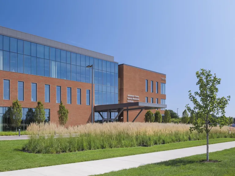 Exterior of Jameson Crane Sports Medicine Institute during the day, a large brick building with large floor to ceiling windows