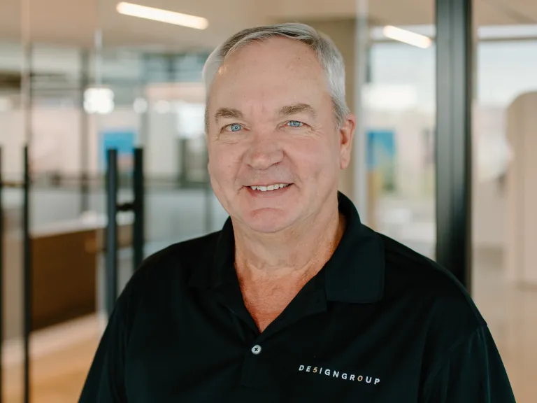 Ken Redman smiling, wearing a black polo shirt