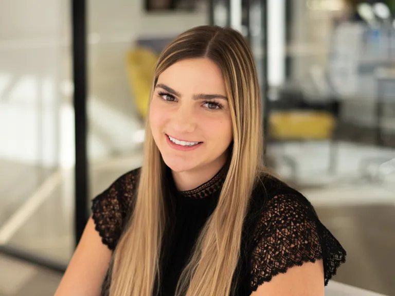 Kristyn Svetlak smiling, wearing a black blouse