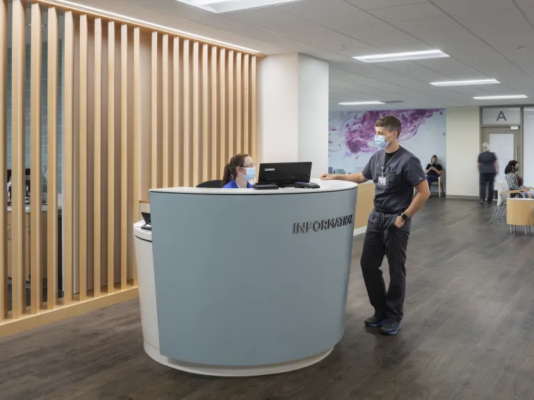 Front desk of Neuroscience Institute, wood panelling and blue accents