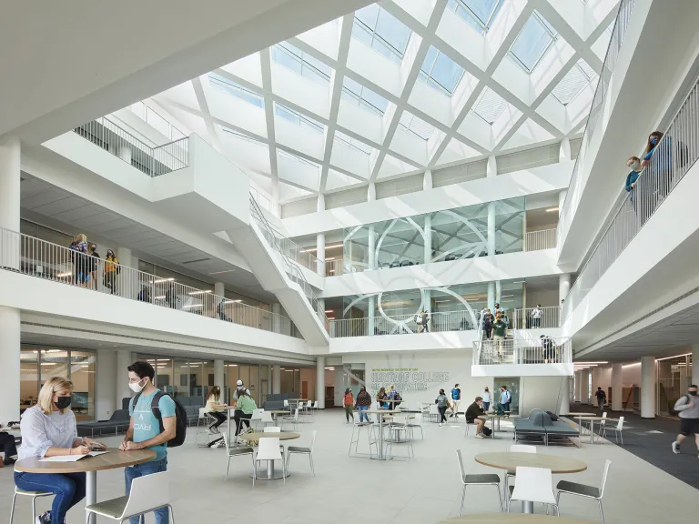 Bright, naturally lit interior view of the Heritage College of Medicine atrium