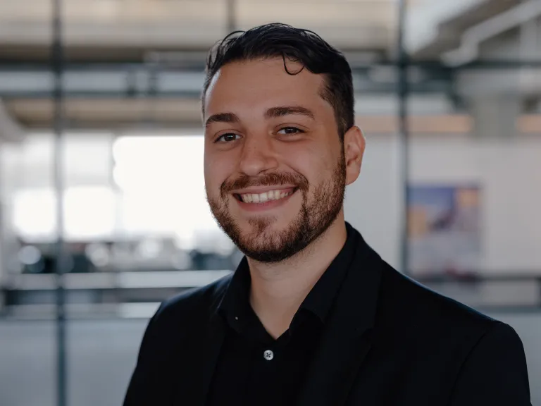 Orlando Echevarria Garcia smiling, wearing a black button down shirt