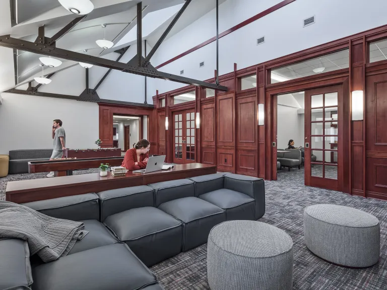 People working in a common room in University of Pittsburgh Club Housing.