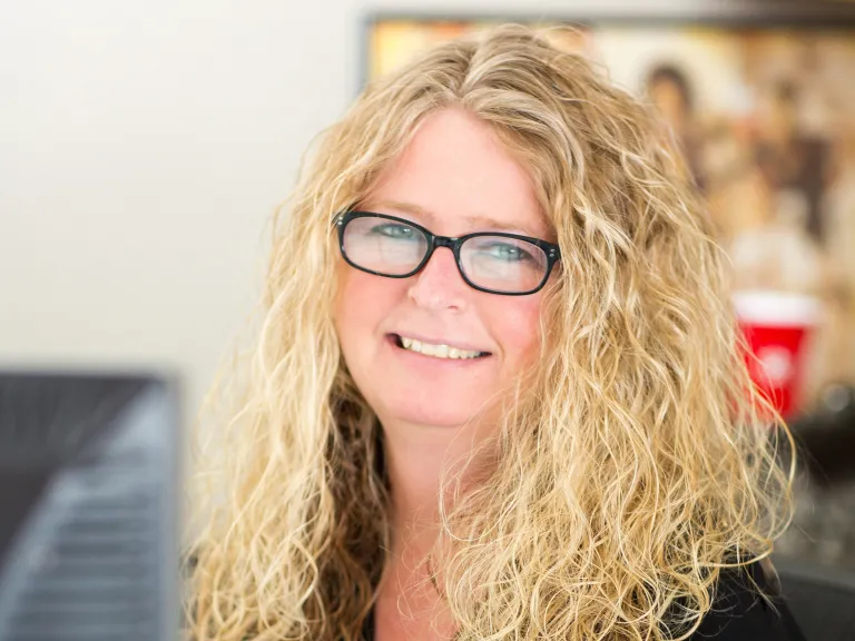 Tammie Wareham smiling, wearing a black blouse