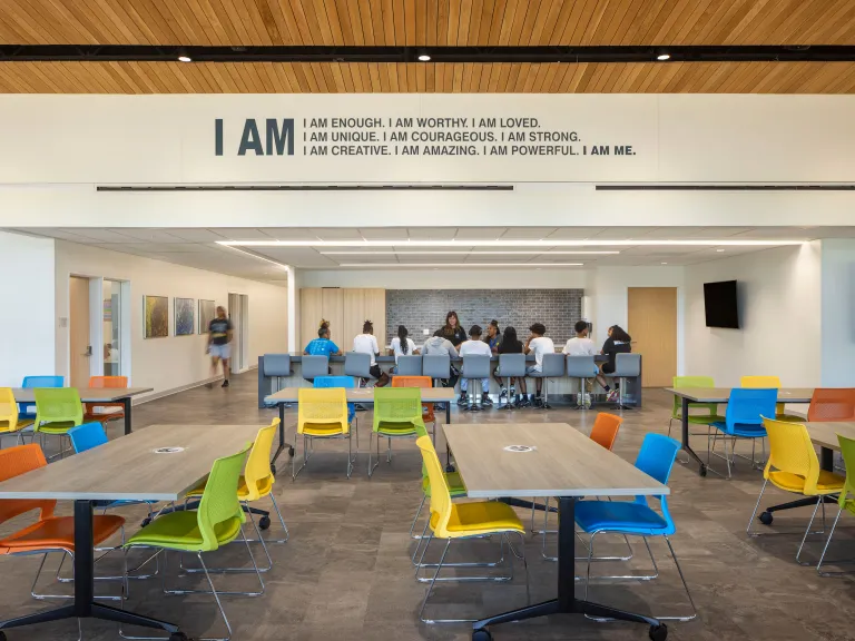 colorful community room with inspiring wall graphic